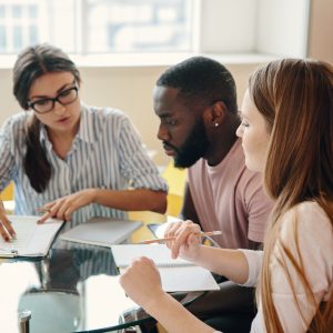 Image representing a group of professionals discussing NVQ Training Courses